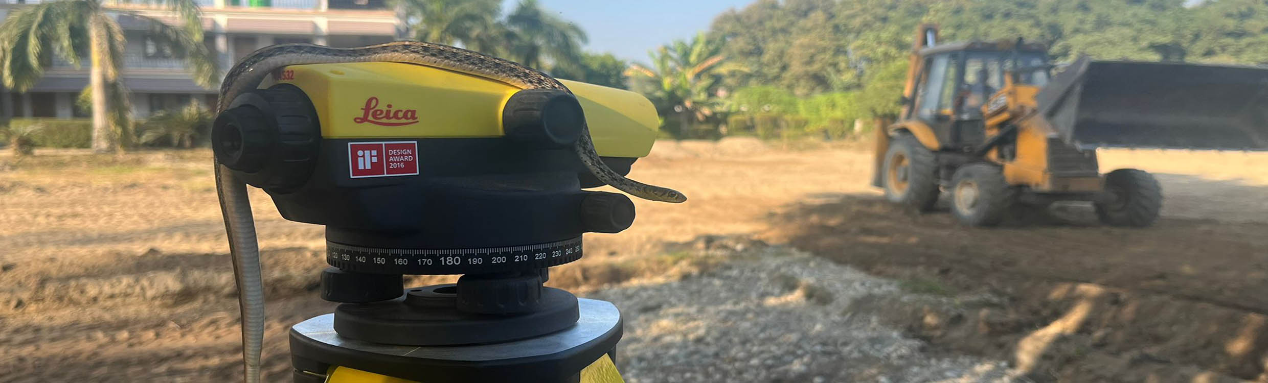 Level with a snake on the top with a excavator in the background